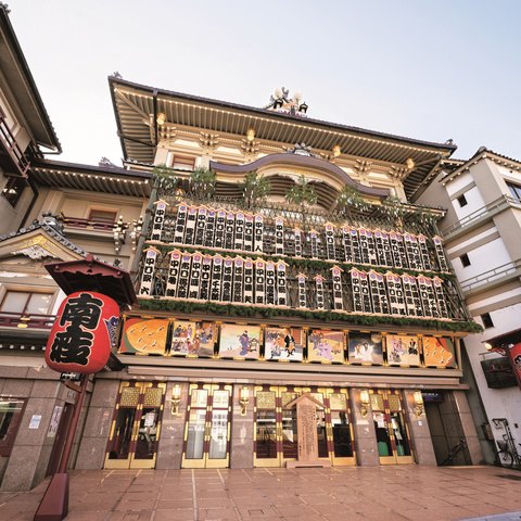 Traditional Japanese performance building with lanterns