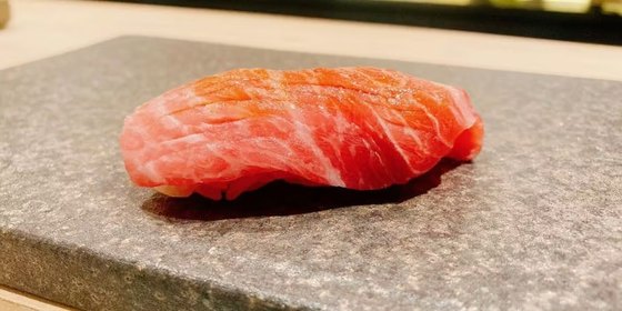 Nigiri sushi on a stone plate